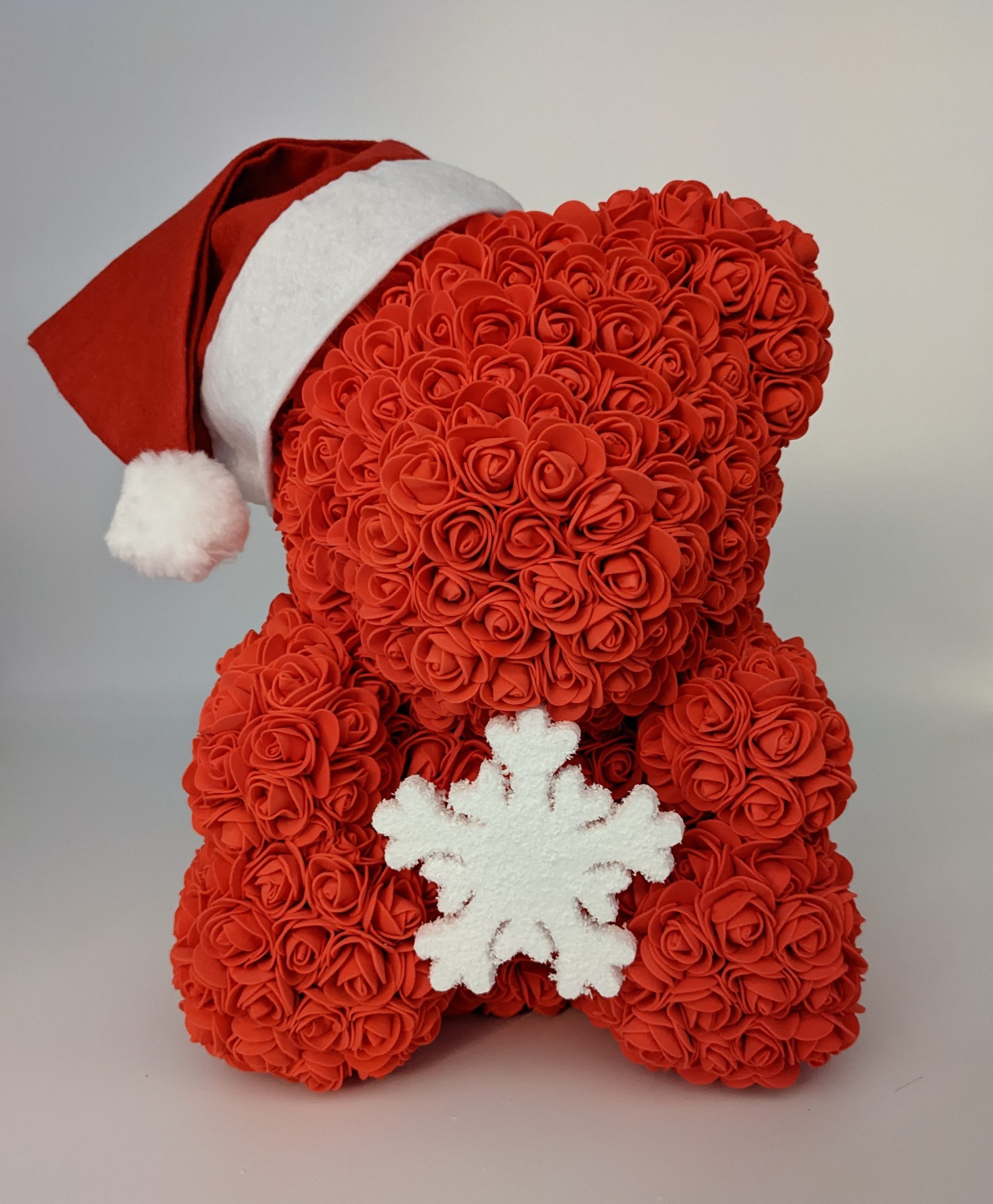 Ours rouge de Noël avec son flocon de neige