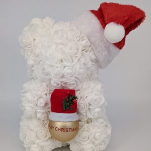 Ourson Noël blanc avec sa boule or et son petit bonnet rouge et blanc