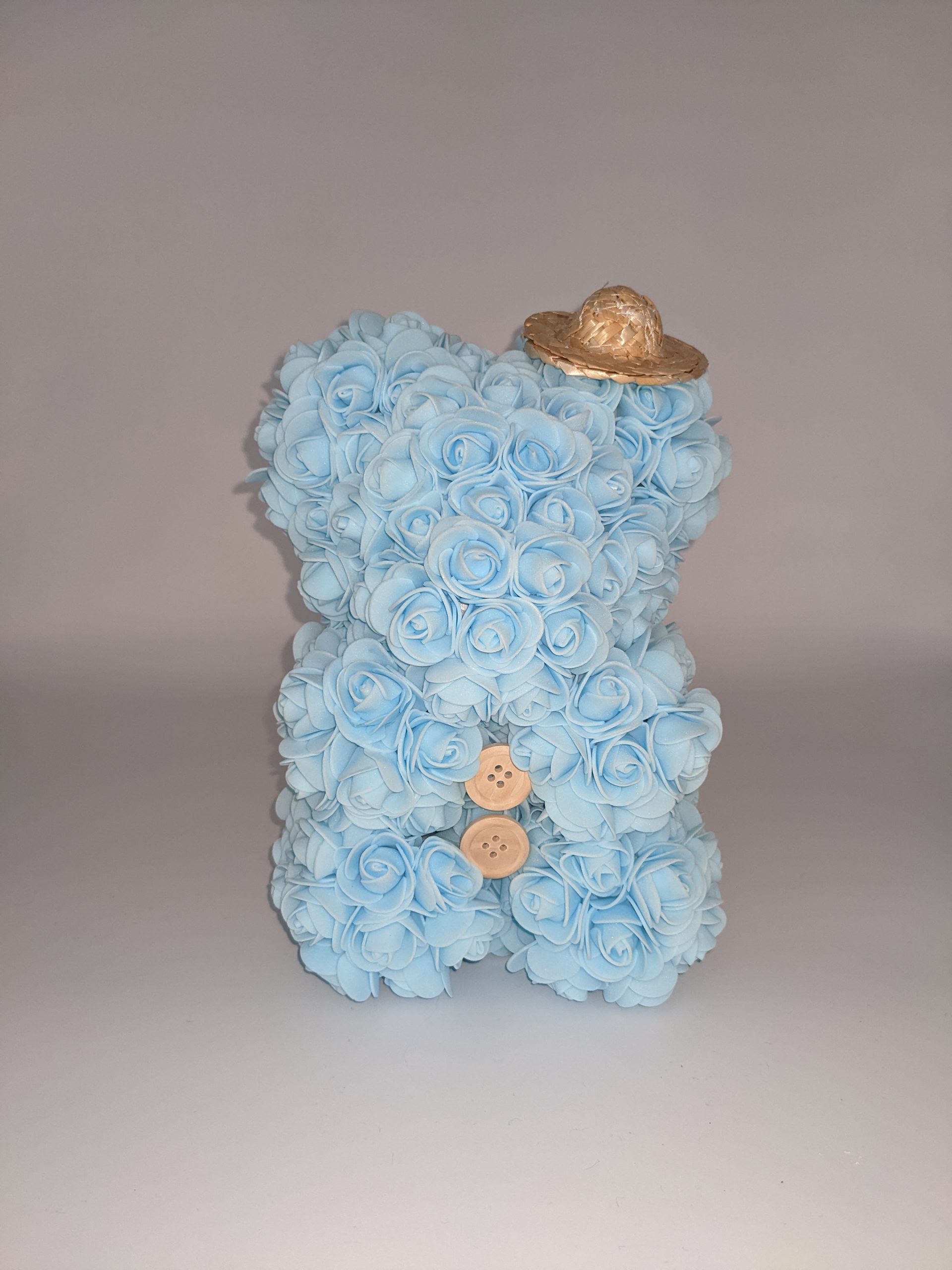 Ourson bleu pâle avec ses accessoires